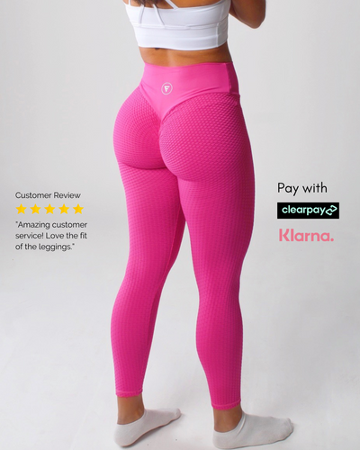 A woman in pink leggings, showcasing active wear for yoga or exercise, emphasizing comfort and flexibility.