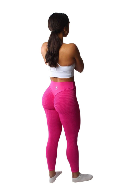 The Nova Honeycomb Scrunch Collection - Scrunch Bum Gym Leggings, featuring a scrunch detail and honeycomb texture, worn by a woman with arms crossed.