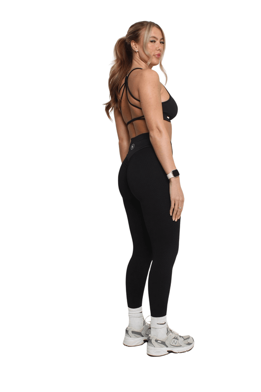Nova Honeycomb Scrunch Collection - Scrunch Bum Gym Leggings, enhancing curves with honeycomb texture, worn by woman in black workout attire with athletic sneakers.
