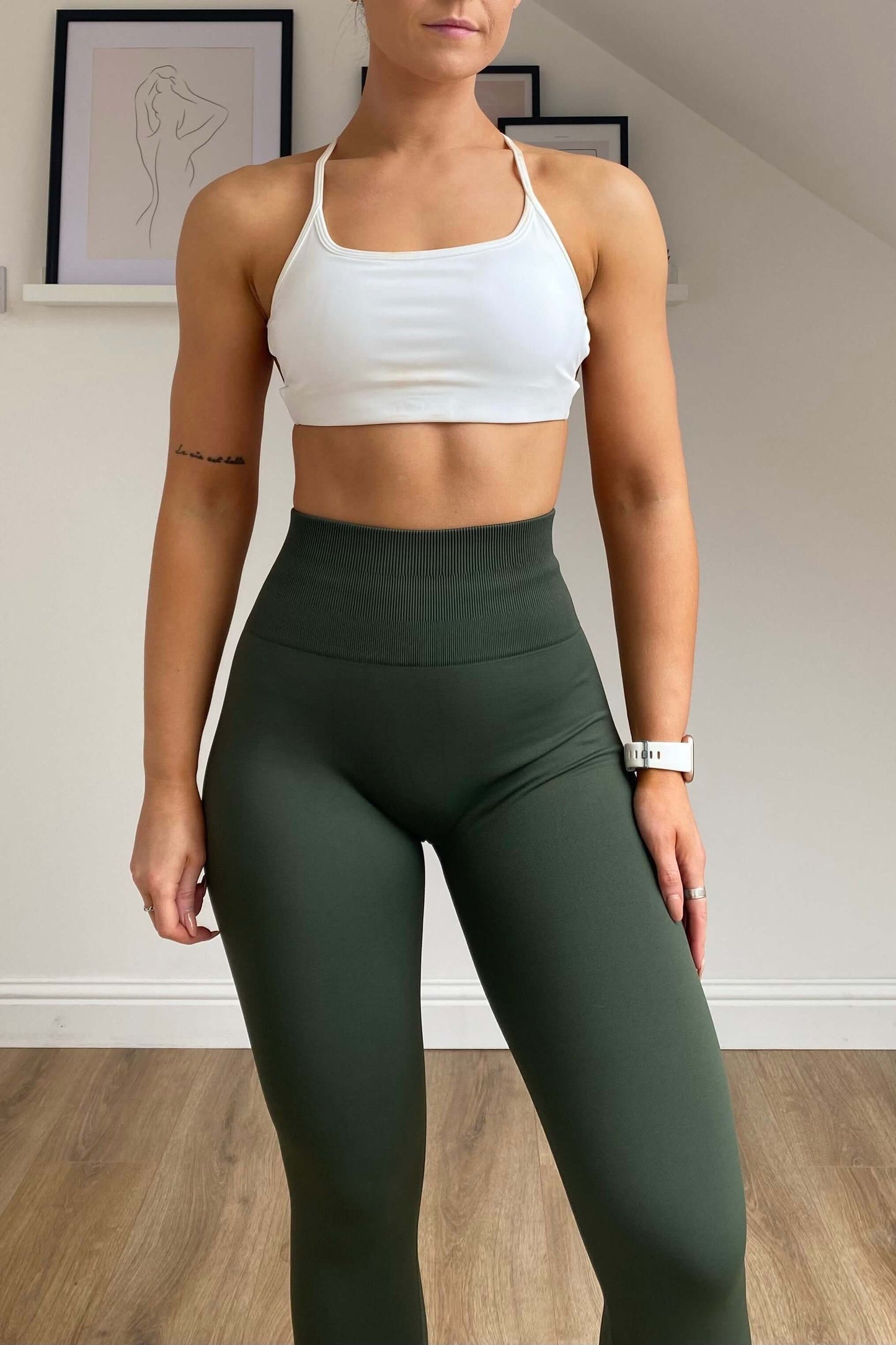 Skin2Skin Scrunch Collection - Scrunch Bum Leggings with ruched design, enhancing silhouette for workouts or casual wear. Seen on a woman's waist and wrist.