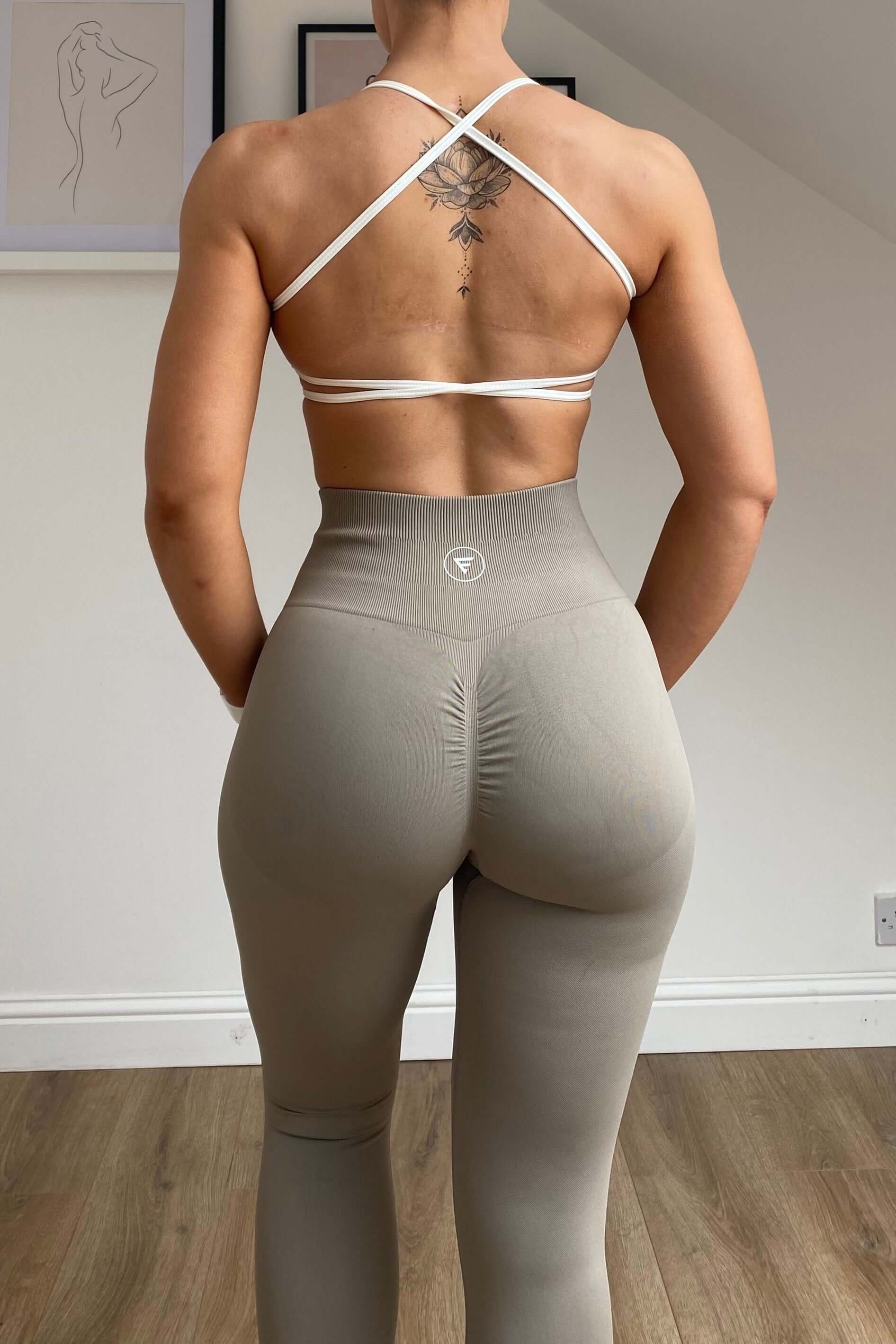 Skin2Skin Scrunch Collection - Scrunch Bum Leggings showcasing ruched design for enhanced silhouette and comfort, emphasizing a sculpted fit on a model's back and midsection.