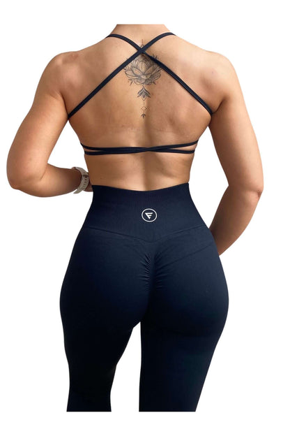 Skin2Skin Scrunch Collection - Scrunch Bum Leggings showcased on a model's back, highlighting the ruched design that enhances and sculpts the silhouette.