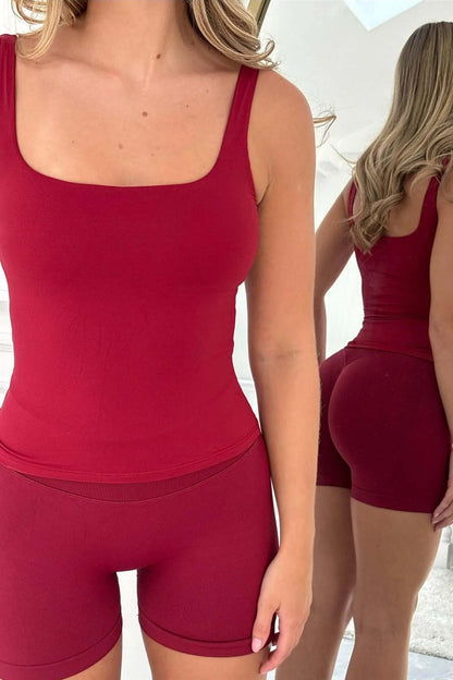 Woman models The Edge Collection - Lightweight Summer Vest, showcasing fit and style in front and back views in a neutral-toned room.