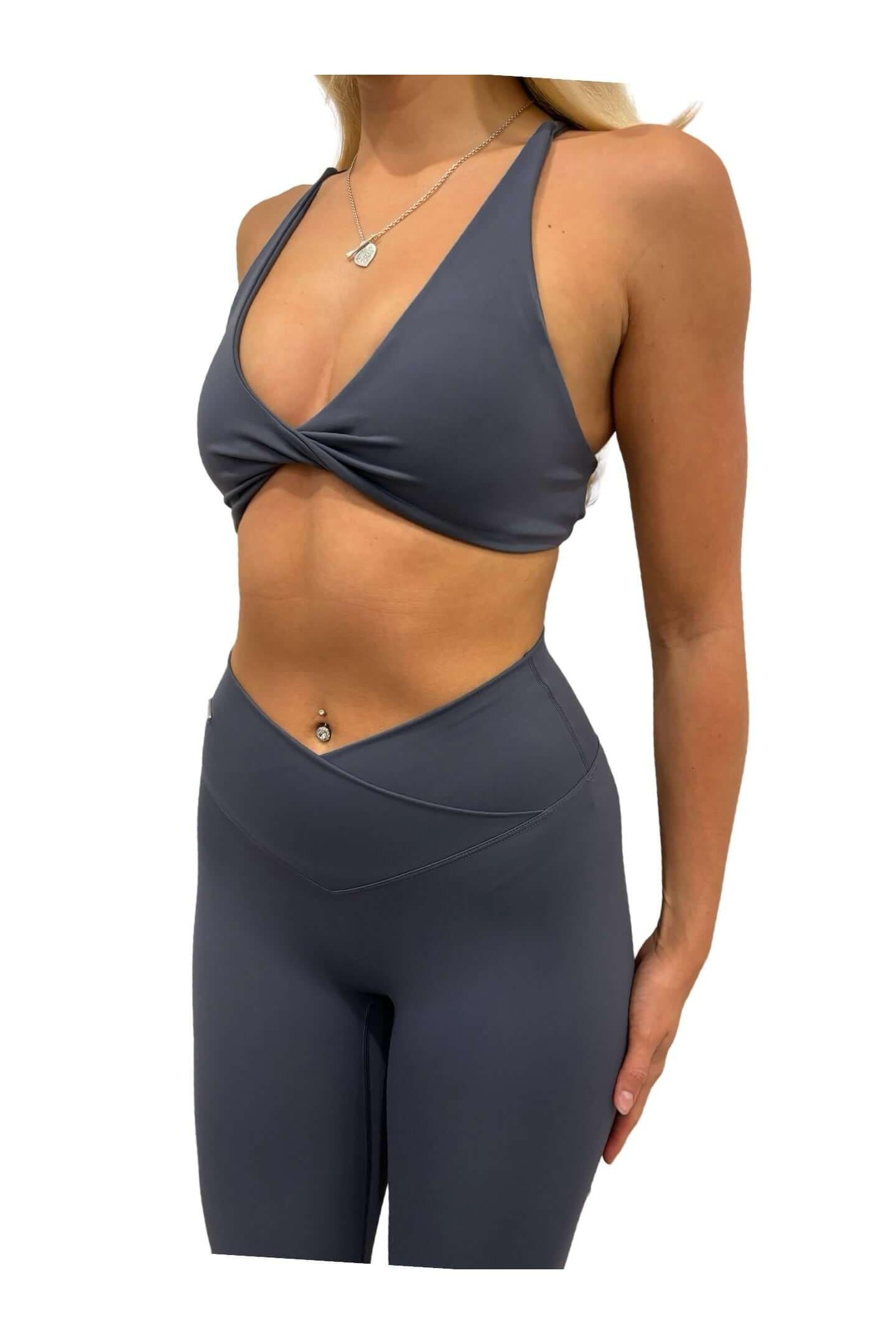 Woman wearing Pilates Reformer Collection - High Waisted Wrap Front Timeless Gym Leggings, showcasing a sleek, supportive fit ideal for workouts.