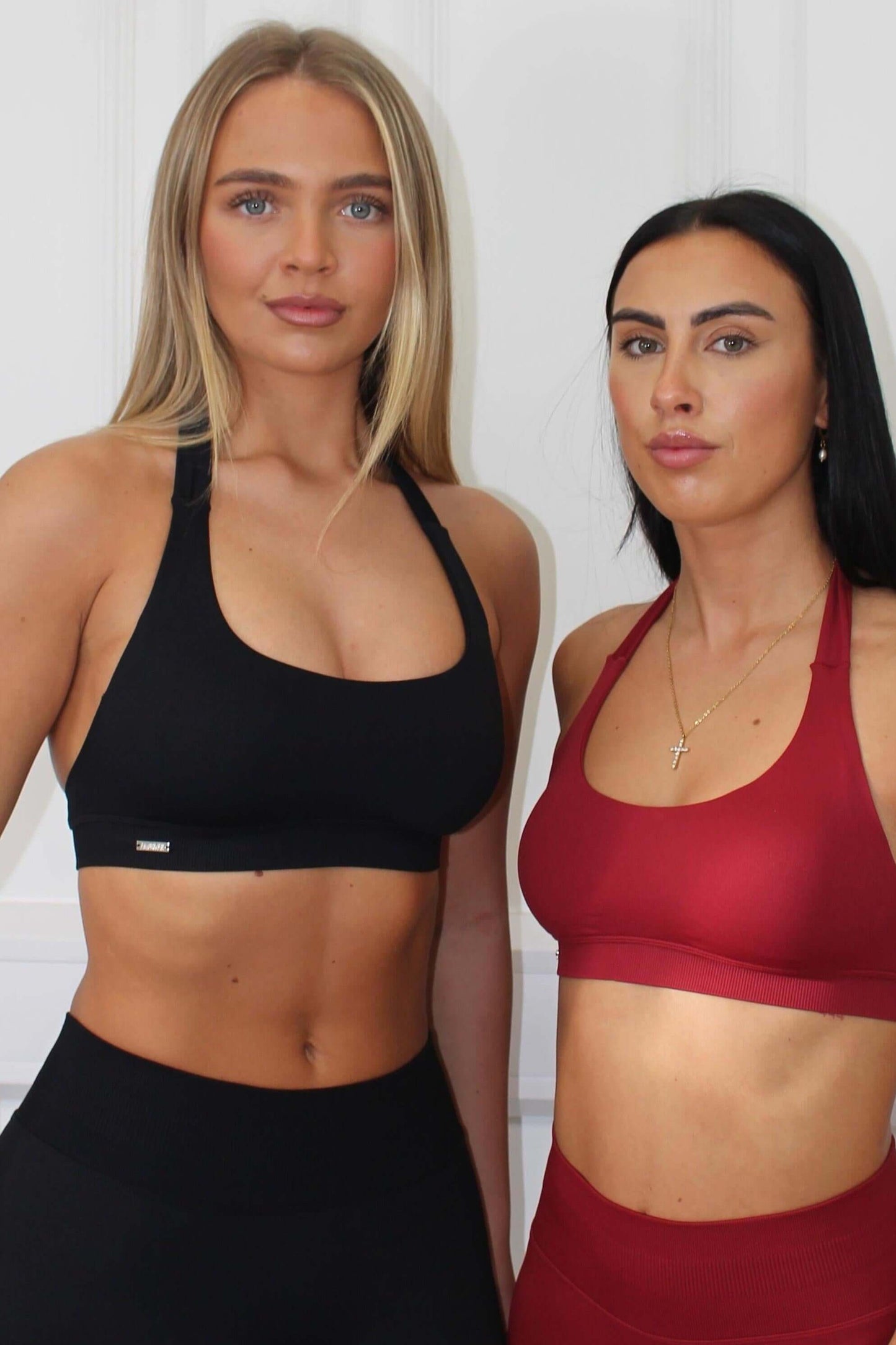 Two women in athletic sets showcase The Edge Collection - Lightweight Summer Vest, emphasizing luxury, comfort, and personalized fit for workouts.
