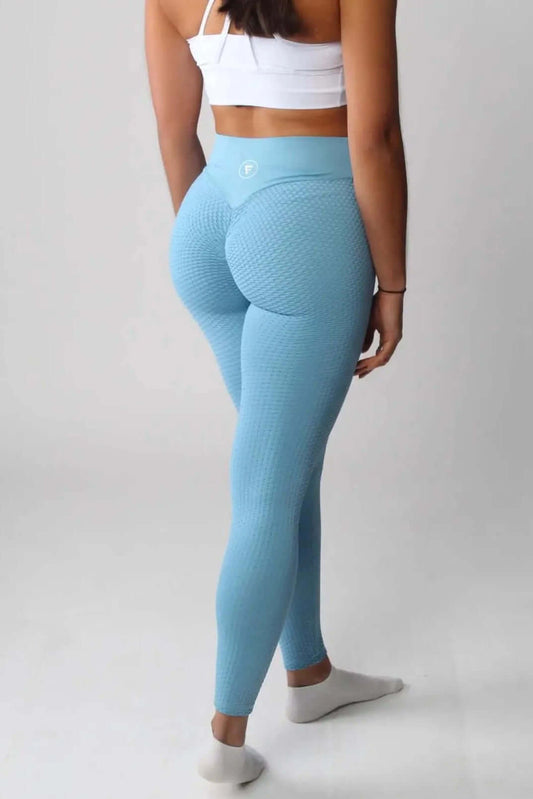 Person wearing The Nova Honeycomb Scrunch Collection - Scrunch Bum Gym Leggings, showcasing high-waisted, textured design and scrunch bum detail for enhanced curves and flexibility.