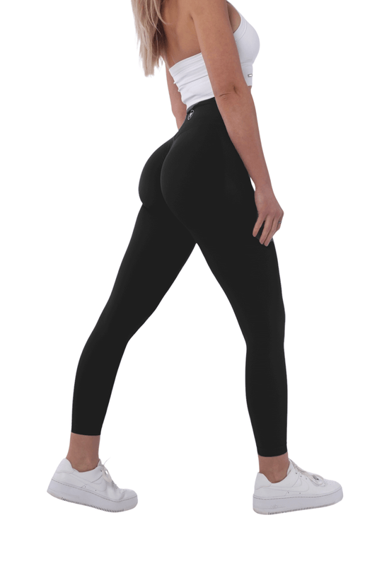 The Nakd Scrunch Collection - Scrunch Bum Gym Leggings showcased with a close-up of the high-waisted, buttery soft design worn by a woman in black leggings.