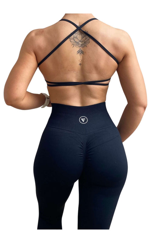 Skin2Skin Scrunch Collection - Scrunch Bum Leggings showcased on a model's back, highlighting the ruched design that enhances and sculpts the silhouette.